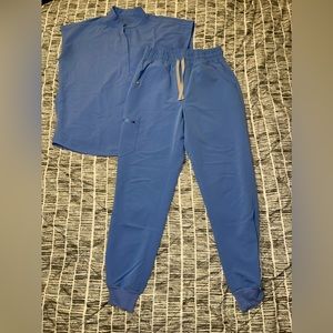 Gently used FIGS scrubs in ceil blue size small